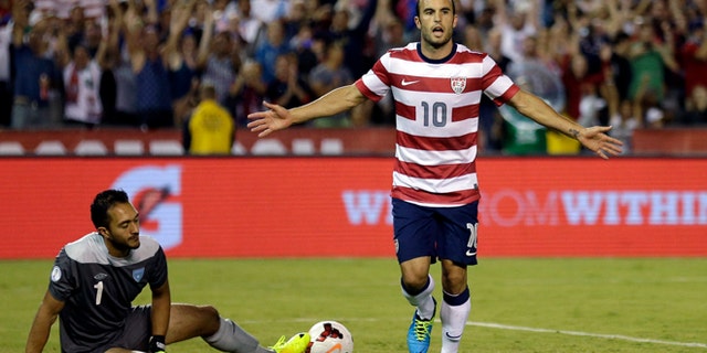 The United States' Landon Donovan, right, reacts after scoring on a penalty kick as Guatemala's goalkeeper Ricardo Jerez gets up at left in the second half during an international friendly soccer match Friday, July 5, 2013, in San Diego. (AP Photo/Gregory Bull)