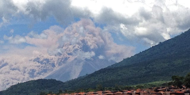 Sept. 13, 2012: In this image with a cell phone plumes of smoke rise from the Volcan de Fuego or Volcano of Fire spews ash seen from Palin, south of Guatemala City.