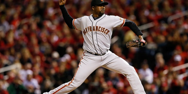ST LOUIS, MO - OCTOBER 18: Guillermo Mota #59 of the San Francisco Giants pitches against the St. Louis Cardinals in Game Four of the National League Championship Series at Busch Stadium on October 18, 2012 in St Louis, Missouri. (Photo by Kevin C. Cox/Getty Images)