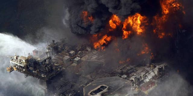 The Deepwater Horizon oil rig is seen burning on April 21, 2010. (AP Photo/Gerald Herbert, File)