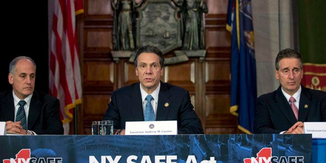 Jan. 14, 2013: New York Gov. Andrew Cuomo, center, speaks during a news conference announcing an agreement with legislative leaders on New York's Secure Ammunition and Firearms Enforcement Act in the Red Room at the Capitol.