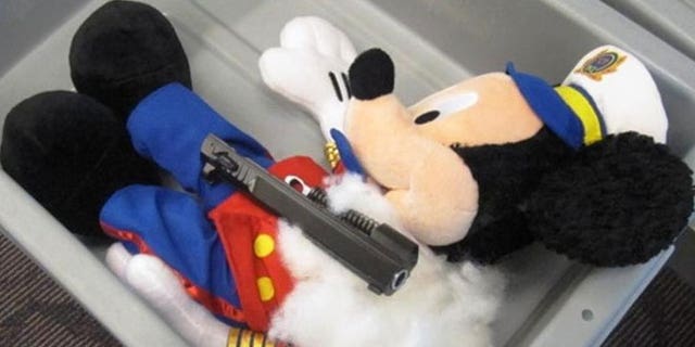 This undated photo provided by the federal Transportation Security Administration shows pistol parts hidden in a stuffed animal found by TSA officials at T.F. Green Airport in Warwick, R.I., Monday May 7, 2012.
