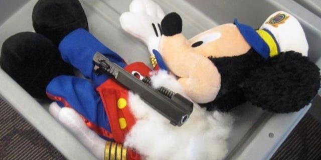 This undated photo provided by the federal Transportation Security Administration shows pistol parts hidden in a stuffed animal found by TSA officials at T.F. Green Airport in Warwick, R.I., Monday May 7, 2012.