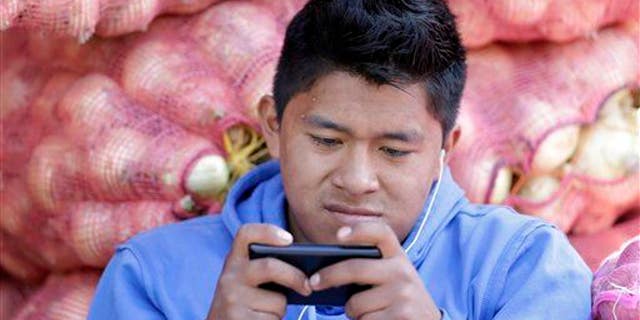 File photo of a man texting.