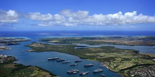 Navy ships are anchored in the waters of Joint Base Pearl Harbor-Hickam on July 14, 2011, at the entrance to the Pacific Ocean. (Credit: MC2 Daniel Barker/Navy)