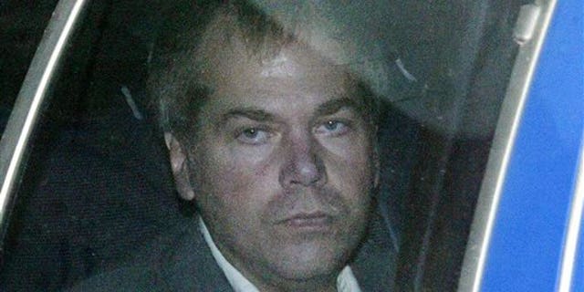 FILE - In this Nov. 18, 2003 file photo, John Hinckley Jr. arrives at U.S. District Court in Washington. The last man to shoot an American president now spends most of the year in a house overlooking the 13th hole of a golf course in a gated community. He takes long walks along tree-lined paths, plays guitar and paints, grabs fast food at Wendys. He drives around town in a silver Toyota Avalon, a car that wouldnt attract a second glance. Often, as if to avoid detection, he puts on a hat or visor before going out. (AP Photo/Evan Vucci, File)