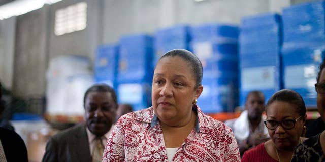 FILE - In this Sept. 10, 2014, file photo, Haiti's first lady Sophia Martelly visits a warehouse housing a donation of kits to treat chikungunya, in the Cite Soleil slum, in Port-au-Prince, Haiti. An elections committee in Haiti has the rejected first lady's bid to run for Senate. Electoral council spokesman Richardson Dumel said Wednesday, May 13, 2015, that the committee would not allow the wife of President Michel Martelly to pursue her candidacy. He did not provide details about the decision. (AP Photo/Dieu Nalio Chery, File)