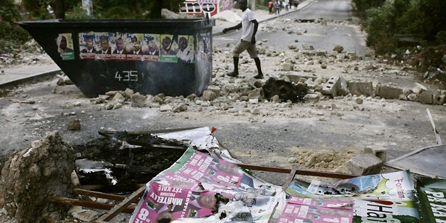 Protests and sporadic gunfire have erupted in Haiti's capital.