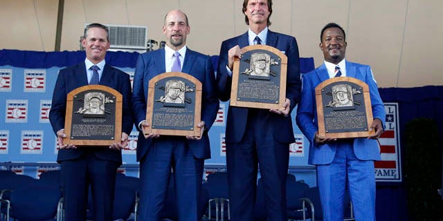 July 26, 2015: Newly-inducted National Baseball Hall of Famers from left to right, Craig Biggio, John Smoltz, Randy Johnson and Pedro Martinez hold their plaques after an induction ceremony at the Clark Sports Center, in Cooperstown, N.Y. (AP Photo/Mike Groll)