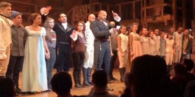 In this image made from a video provided by Hamilton LLC, actor Brandon Victor Dixon who plays Aaron Burr, the nations third vice president, in "Hamilton" speaks from the stage after the curtain call in New York, Friday, Nov. 18, 2016. Vice President-elect Mike Pence is the latest celebrity to attend the Broadway hit "Hamilton," but the first to get a sharp message from a cast member from the stage. (Hamilton LLC via AP)