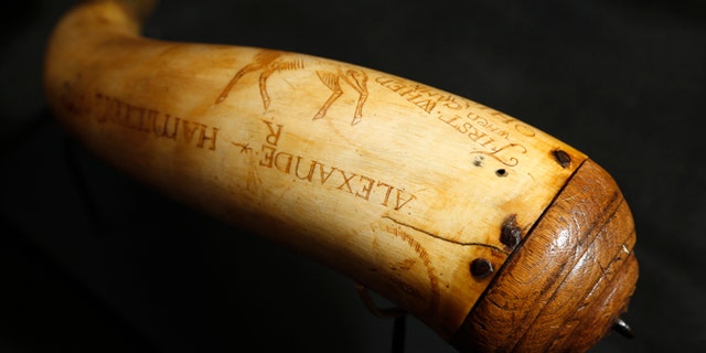 In a Tuesday, Dec. 15, 2015, photo, a horn believed to have been owned by Alexander Hamilton is photographed at Antique NJ in Closter, N.J. The horn will be put up for auction on Jan. 11, 2016. (AP Photo/Julio Cortez)