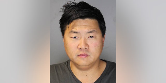FILE - This file photo provided Sept. 20, 2013 by the Suffolk County District Attorney's Office shows Jason Lee in Hauppauge, N.Y. The former New York City investment banker will allow a Long Island judge to decide his fate on charges he raped a woman he met at a nightclub while celebrating his birthday in the Hamptons. (AP Photo/Suffolk County District Attorney's Office, File)