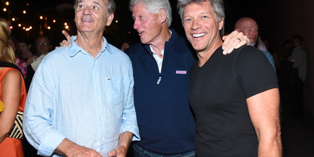 Actor Bill Murray, left, former U.S. President Bill Clinton, center, and musician Jon Bon Jovi attend the Hamptons Sneak Screening of Open Road Films' "Rock the Kasbah" after party on Friday, Aug. 28, 2015 in East Hampton, N.Y.