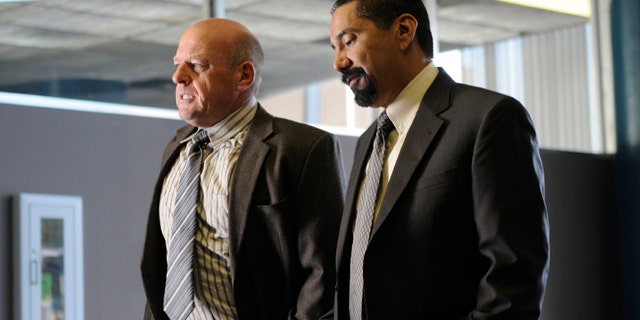 Hank Schrader (Dean Norris) (left) and Steven Gomez (Steven Michael Quezada) (right) appear in an epsiode of AMC's "Breaking Bad."