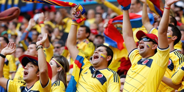 Colombia fans celebrate during a World Cup match on June 19, 2014 in Brasilia, Brazil.
