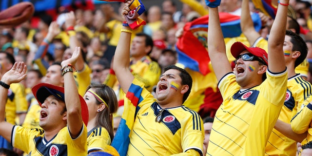 Colombia fans celebrate during a World Cup match on June 19, 2014 in Brasilia, Brazil.
