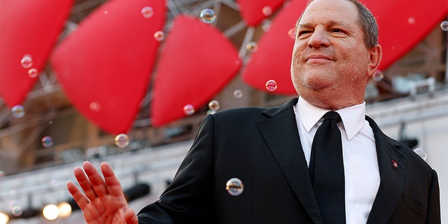 Harvey Weinstein poses on the red carpet on Aug. 31, 2013. Weinstein has been accused of raping, assaulting and harassing women in Hollywood.
