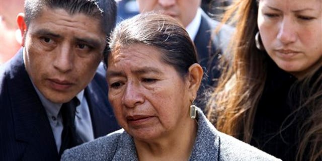 April 19, 2010: Rosario Lucero, center, her son Joselo and daughter Isabel stand near the site where her son Marcelo Lucero was stabbed to death in Patchogue, N.Y.