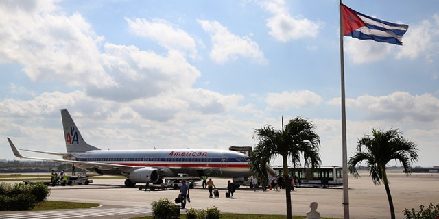 HAVANA, CUBA - JANUARY 19: Passengers walk across the tarmac at Jose Marti International Airport after arriving on a charter plane operated by American Airlines January 19, 2015 in Havana, Cuba. Officials from the Cuban and United States governments will hold meetings this week in Havana to being establishing migration agreements and noramalized relations. (Photo by Chip Somodevilla/Getty Images)