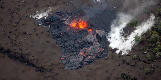 March 6: Scientists fly in a helicopter above the Pu'u O'o vent on Kilauea Volcano in Hawaii. Scientists say the Pu'u O'o crater floor has collapsed and an eruption occurred along the middle of Kilauea Volcano's east rift zone.