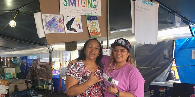 Baylina Kahalepauole (left) works side by side with her daughter, Lilinoe Kahalepauole at the Pu’uhonua o Puna donation center. Both say they’ve heard from residents displaced and on edge about life in a post-Kilauea world.