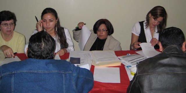 Massachusetts residents enrolling for healthcare at the Latino Health Insurance Program.