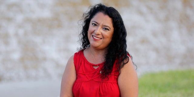 Rebecca Esparza, a two-time cancer survivor, poses for photos at the Watergardens in Corpus Christi, Texas on Thursday, July 14, 2016. She says repealing the federal Affordable Care Act, as Republicans have tried to do dozens of times in Congress, could make her uninsurable. "I realize this is something that could happen... It's a terrifying thought for me not to have any insurance at all." (AP Photo/Eric Gay)