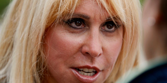 FILE - In this June 10, 2011 file photo, Lynn Tilton speaks in Gorham, N.H. The Army has awarded $80 million in helicopter contracts to Wall Street executive Lynn Tilton even as the Justice Department is investigating whether she played by the rules to win earlier military work. (AP Photo/Robert F. Bukaty, File)