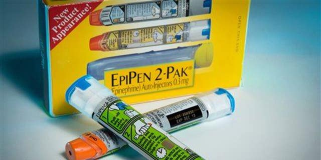 Examples of epinephrine pens that the Center for Disease Control and  Prevention guidelines recommend that schools stock to combat food allergies are photographed in Washington on Nov. 13, 2013.