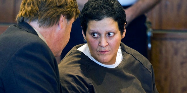 FILE - In this Oct. 24, 2013 file photo, Tanya Singleton, right, cousin of former New England Patriots football player Aaron Hernandez, speaks with defense attorney Peter Parker during a bail hearing at Superior Court in Fall River, Mass. Singleton was released on bail Thursday, Jan. 30, 2013, more than five months after her indictment on two charges in connection with the murder case against Hernandez. (AP Photo/Boston Herald, Dominick Reuter, Pool, File)