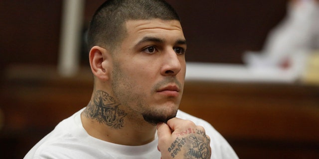 Former New England Patriots NFL football player Aaron Hernandez attends a pre-trial hearing at Suffolk Superior Court, Tuesday, Dec. 22, 2015, in Boston. Hernandez is charged with killing two Boston men in 2012 after a chance encounter at a nightclub. (AP Photo/Steven Senne, Pool)