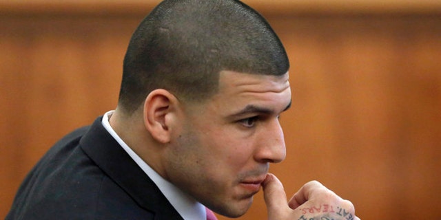 Former New England Patriots NFL football player Aaron Hernandez is seated during his murder trial, Thursday, April 2, 2015, in Fall River, Mass. Hernandez is charged with killing Odin Lloyd in June 2013. (AP Photo/Steven Senne, Pool)