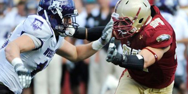 In this Sept. 4, 2010, file photo, Boston College's Mark Herzlich, right, rushes against Weber State's Brian Jankowski during an NCAA college football game in Boston. Herzlich is heading into the NFL draft after missing a season with BC because of cancer. The linebacker returned to play in 2010 and is one of 25 college players scheduled to attend the draft in New York that begins Thursday night, April 27.