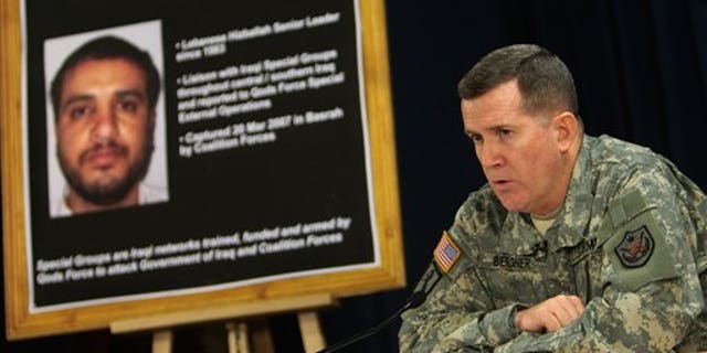 July 2, 2007: U.S. military spokesman Brig. Gen. Kevin J. Bergner speaks in Baghdad near a poster of senior Hezbollah operative Ali Musa Daqduq.