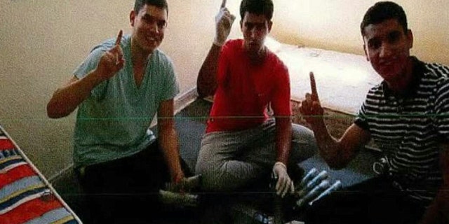 Mohamed Hichamy, left, Youssef Aalla, center, and Younes Abouyaaqoub, right, post with explosives at a home in Alcanar, Spain.