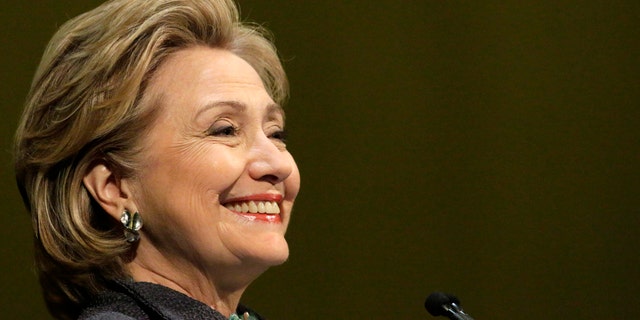 Former Secretary of State Hillary Rodham Clinton smiles out to the crowd in Chicago, Wednesday, June 11, 2014, during an event to promote her new book. Hillary Clinton is returning to New York on Thursday for more stops on her book promo blitz. The former secretary of state and potential 2016 presidential contender will be making multiple stops in the city on Thursday. (AP Photo/Stacy Thacker)