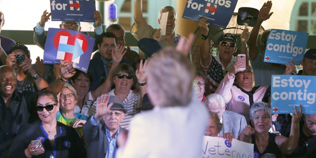 SAN ANTONIO, TX - OCTOBER 15:  Democratic U.S. presidential hopeful Hillary Clinton acknowledges supporters at a "Latinos for Hillary" grassroots event October 15, 2015 in San Antonio, Texas. The event was part of the campaign's ongoing effort to build an organization outside of the four early states and work hard for every vote.  (Photo by Erich Schlegel/Getty Images)
