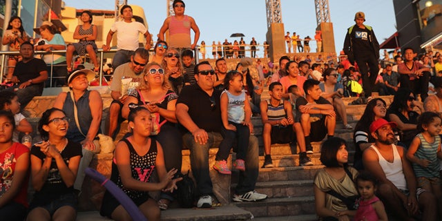 TIJUANA, MEXICO - SEPTEMBER 25: Mexicans enjoy a late afternoon near the U.S.-Mexico border fence which ends in the Pacific Ocean on September 25, 2016 in Tijuana, Mexico. Friendship Park, located on the border between the two countries is one of the few places on the 2,000-mile border where separated families are allowed to meet. (Photo by John Moore/Getty Images)