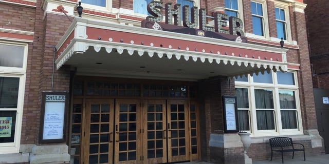 This Sunday, May 22, 2016 photo shows the newly refurbished Shuler Theater in downtown Raton, N.M. The theater is one of many theaters in rural New Mexico towns being revitalized thanks to a state initiative. A New Mexico economic development program, similar to efforts in Iowa and Illinois, seeks to save the often-forgotten theaters in small cities and towns with help on refurbishing buildings and grants for new digital projection and sound equipment. (AP Photo/Russell Contreras)