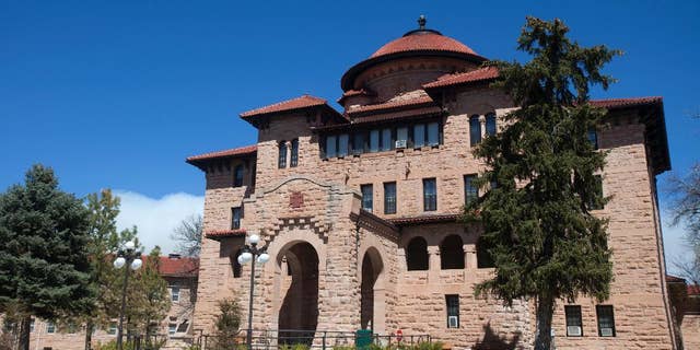 This photo taken April 13, 2015, shows exterior of the grand rotunda entry to the historic Black Hills VA in Hot Springs, S.D. The 108-year-old veteran’s hospital built of thick blocks of pink sandstone and topped with red, tiled roofs in a Spanish mission-style overlooks the tiny town of Hot Springs, a scenic escape that’s become a haven known for healing veterans over the last century. (AP Photo/Kristina Barker)