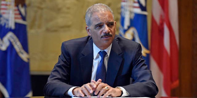 September 16, 2014: Attorney General Eric Holder speaks during an interview with The Associated Press at the Justice Department in Washington. Broadening its push to improve police relations with minorities, the Justice Department has enlisted a team of criminal justice researchers to study racial bias in law enforcement in five American cities and recommend strategies to address the problem nationally, Holder said Tuesday. (AP Photo/Susan Walsh)