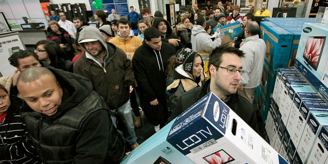 Nov. 25, 2011: Black†Friday shoppers rush into Best Buy in North Dartmouth, Mass.