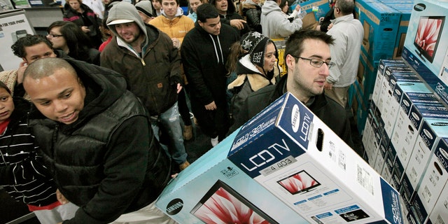 Nov. 25, 2011: Black†Friday shoppers rush into Best Buy in North Dartmouth, Mass.