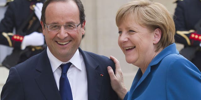 June 27, 2012: French President Francois Hollande, left, welcomes German Chancellor Angela Merkel at the Elysee Palace.