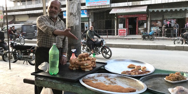 Mahmoud, a 60-year-old sweets seller, was grateful about being spared the aerial bombardment that has ravaged much of Syria.