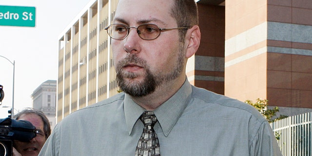 FILE - In this Nov. 1, 2011 file photo, Christopher Chaney, 35, of Jacksonville, Fla., leaves federal court in Los Angeles. Chaney has agreed to plead guilty to hacking into the email accounts of celebrities such as Christina Aguilera, Mila Kunis and Scarlett Johansson, whose nude photos eventually landed on the Internet, according to court documents filed Thursday, March 22, 2012. Long before Christopher Chaney made headlines by hacking into the email accounts of such stars as Scarlett Johansson and Christina Aguilera, he honed his craft at the expense of two women who say he harassed them and stalked them online. (AP Photo/Reed Saxon, File)
