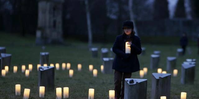 Israelis and people around the world mark Holocaust Remembrance Day on Wednesday, April 15, 2015. A child is pictured at a commemoration ceremony at the Jewish Cemetery in the former Nazi concentration camp Terezin, in Terezin, Czech Republic, on International Holocaust Remembrance Day, Jan. 27, 2015.