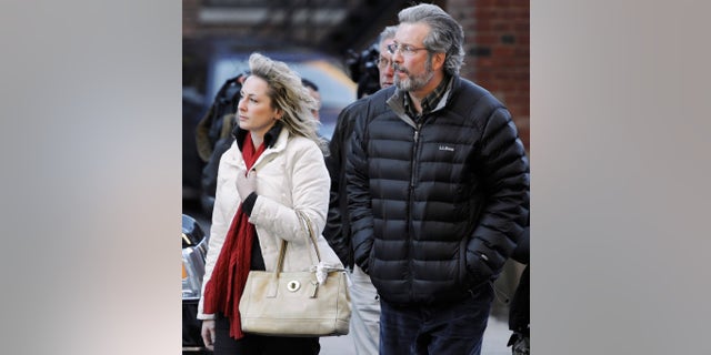 FILE - photo of Dr. William Petit Jr. arriving at Superior Court in New Haven with friend Christine Paluf.