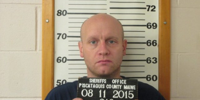 This photo provided by the Piscataquis County Sheriff’s Department shows Robert Burton on Tuesday, Aug. 11, 2015. Burton, who broke into his ex-girlfriend's home, fatally shot her while her children slept and then spent more than two months hiding in the woods turned himself in on Tuesday, officials said. (Piscataquis County Sheriff’s Department via AP)