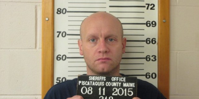 This photo provided by the Piscataquis County Sheriff’s Department shows Robert Burton on Tuesday, Aug. 11, 2015. Burton, who broke into his ex-girlfriend's home, fatally shot her while her children slept and then spent more than two months hiding in the woods turned himself in on Tuesday, officials said. (Piscataquis County Sheriff’s Department via AP)
